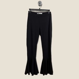 Susana Monaco black stretch jersey pants with flounced hem. Pull on style.